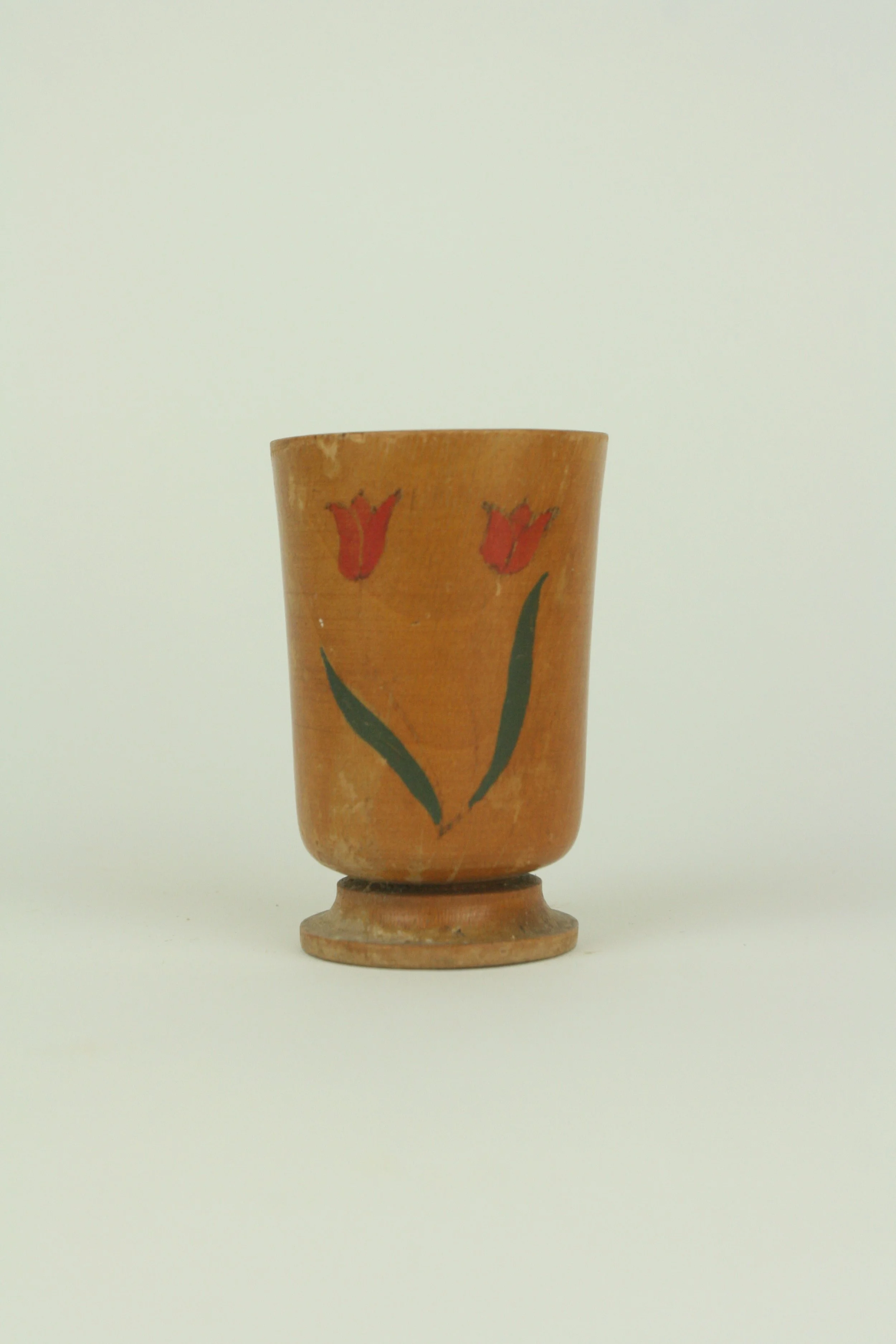 Cup with red tulips
