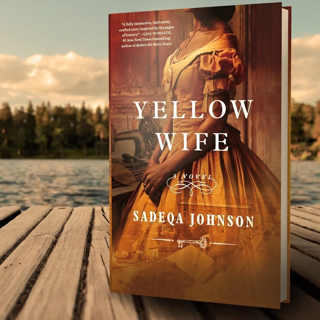 Book cover of 'Yellow Wife' by Sadeqa Johnson, featuring a woman in historical clothing standing indoors, overlooking a window with a warm golden hue