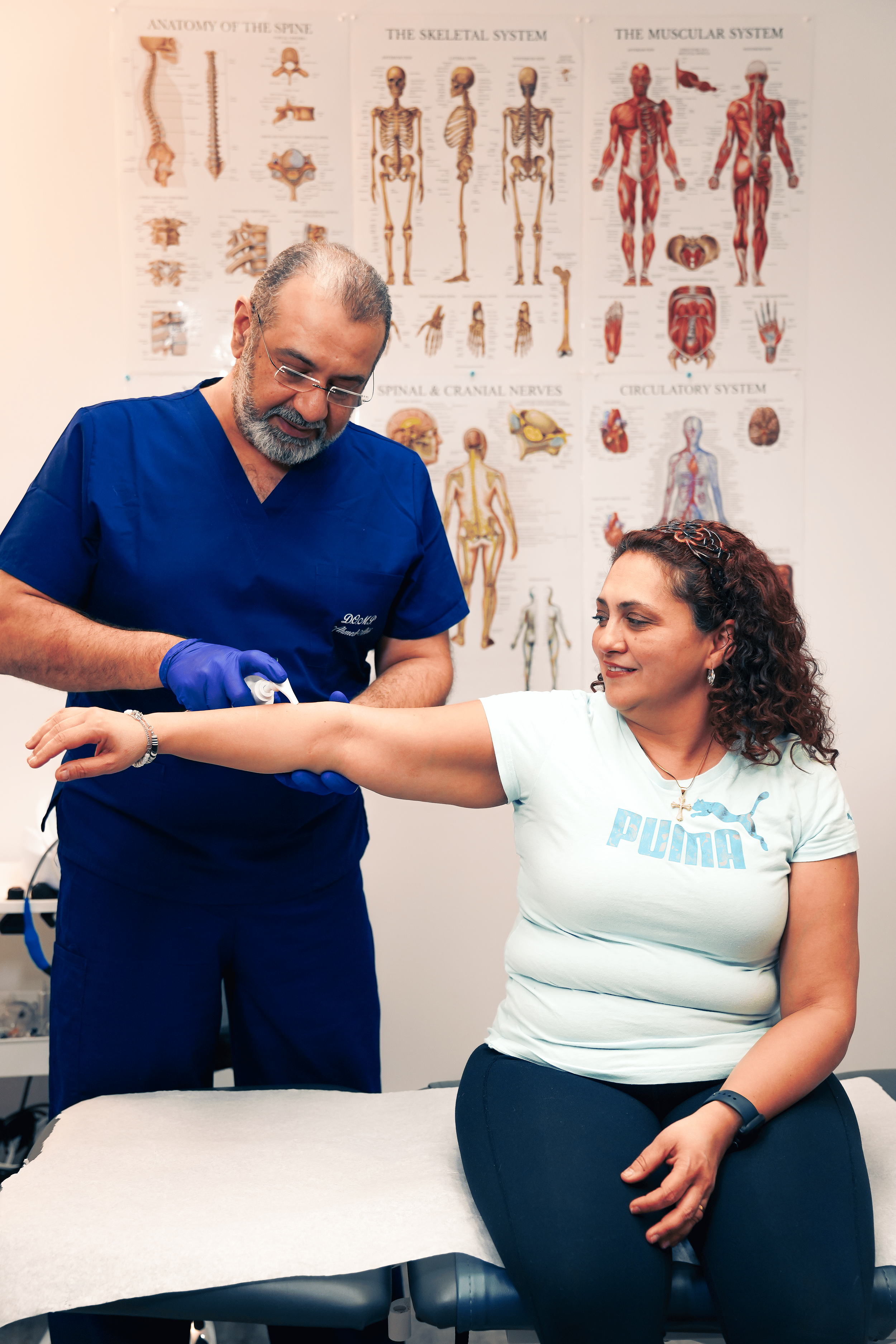 A person lying on their side with a hand placed on their chest, indicating chest compression during CPR.