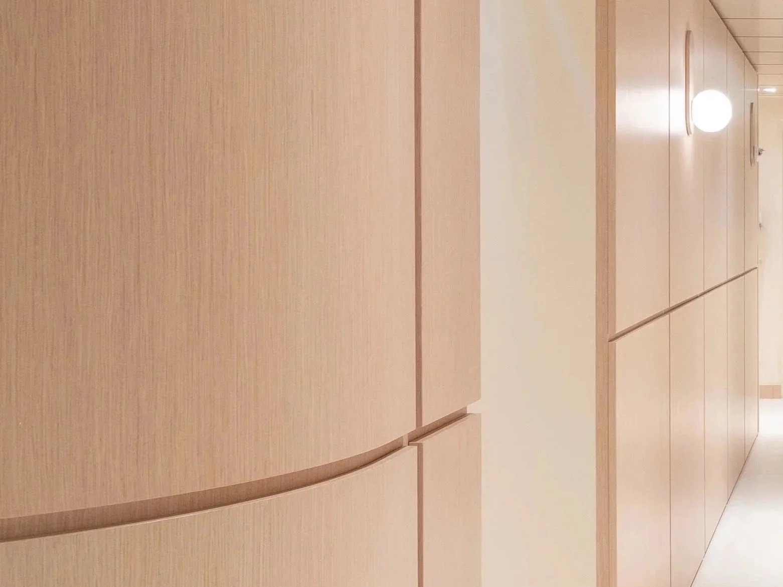 Wooden wall panels with lighting fixtures.