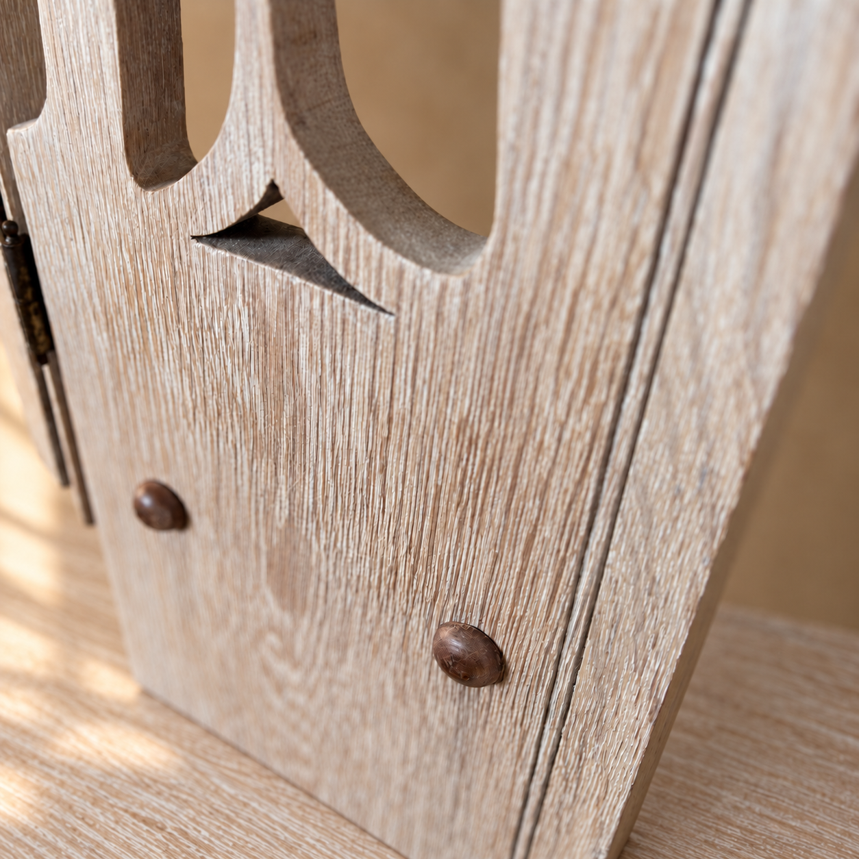 Carved wooden support on limed oak.png