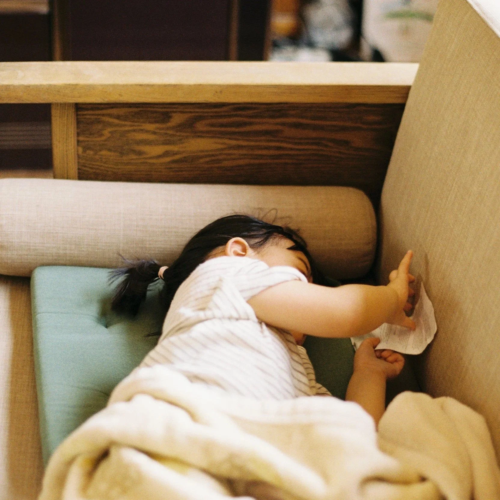 child sleeping on couch