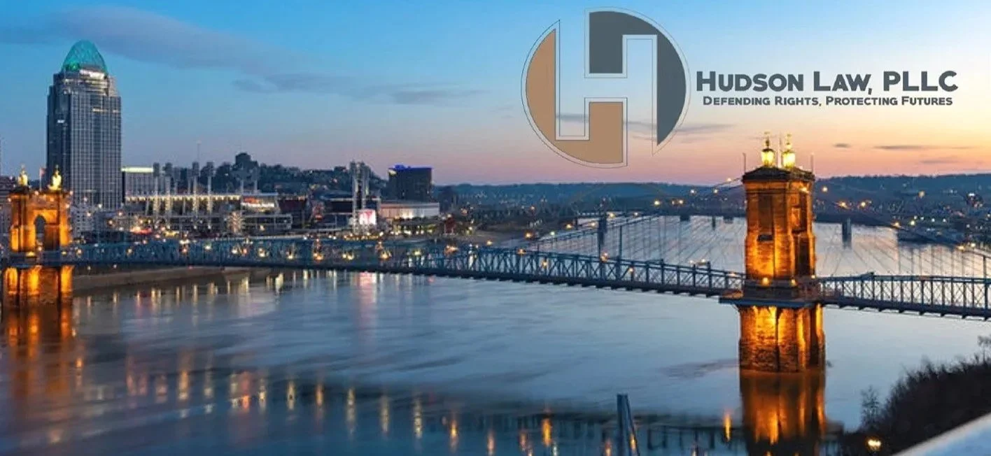 Photograph of the Ohio River at sunset with Hudson Law logo