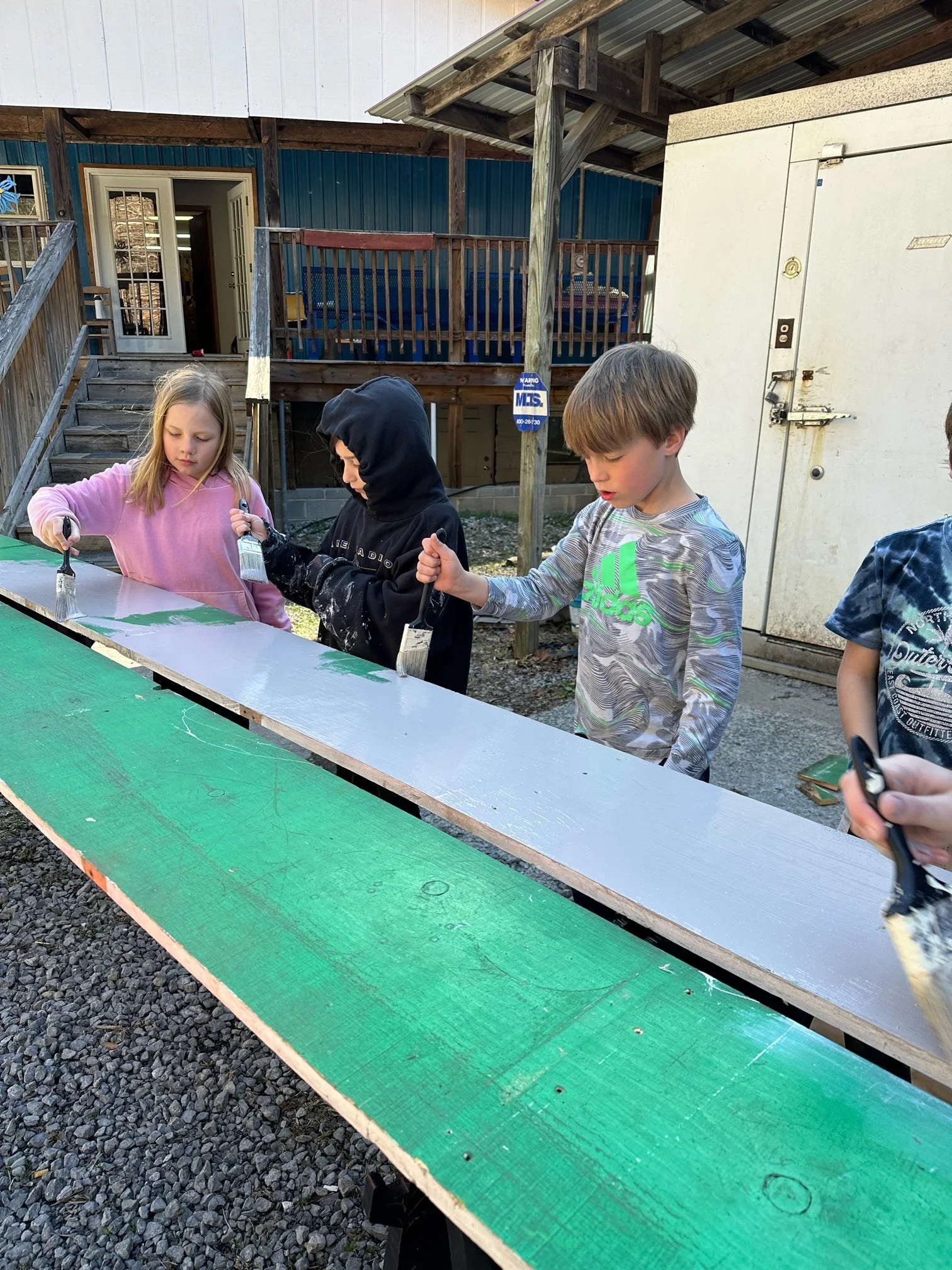 Children working on a painting project with St. James's Episcopal Church
