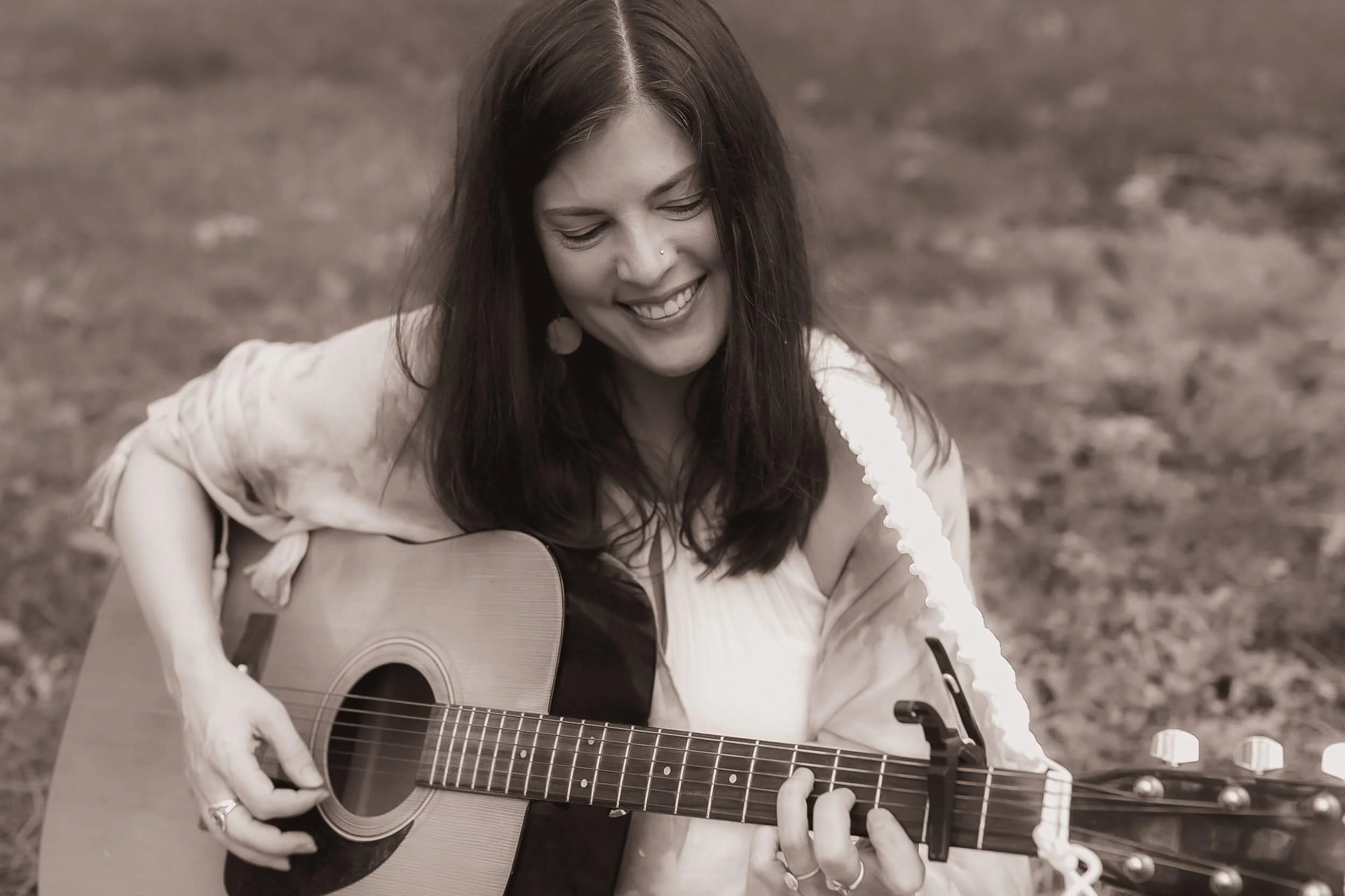Kristi Amdahl playing the guitar