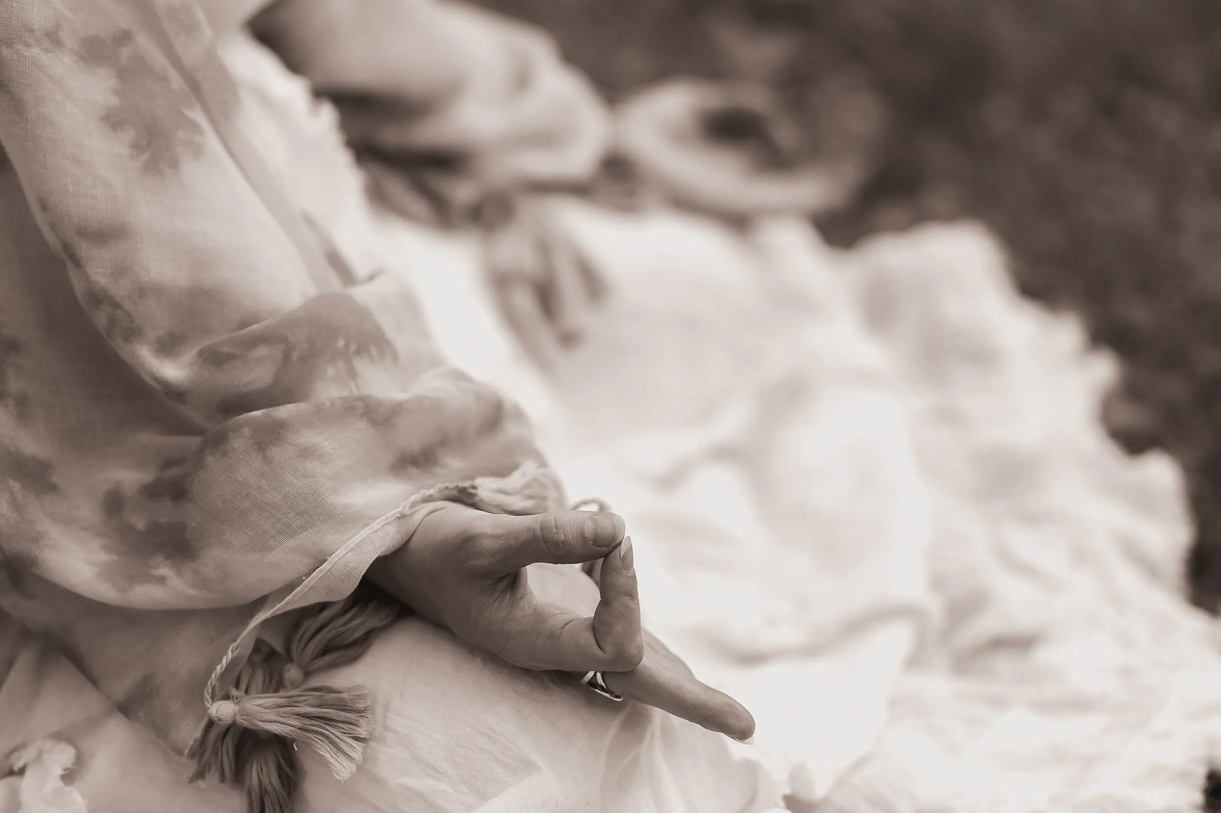 Kristi meditating with hands in a mudra
