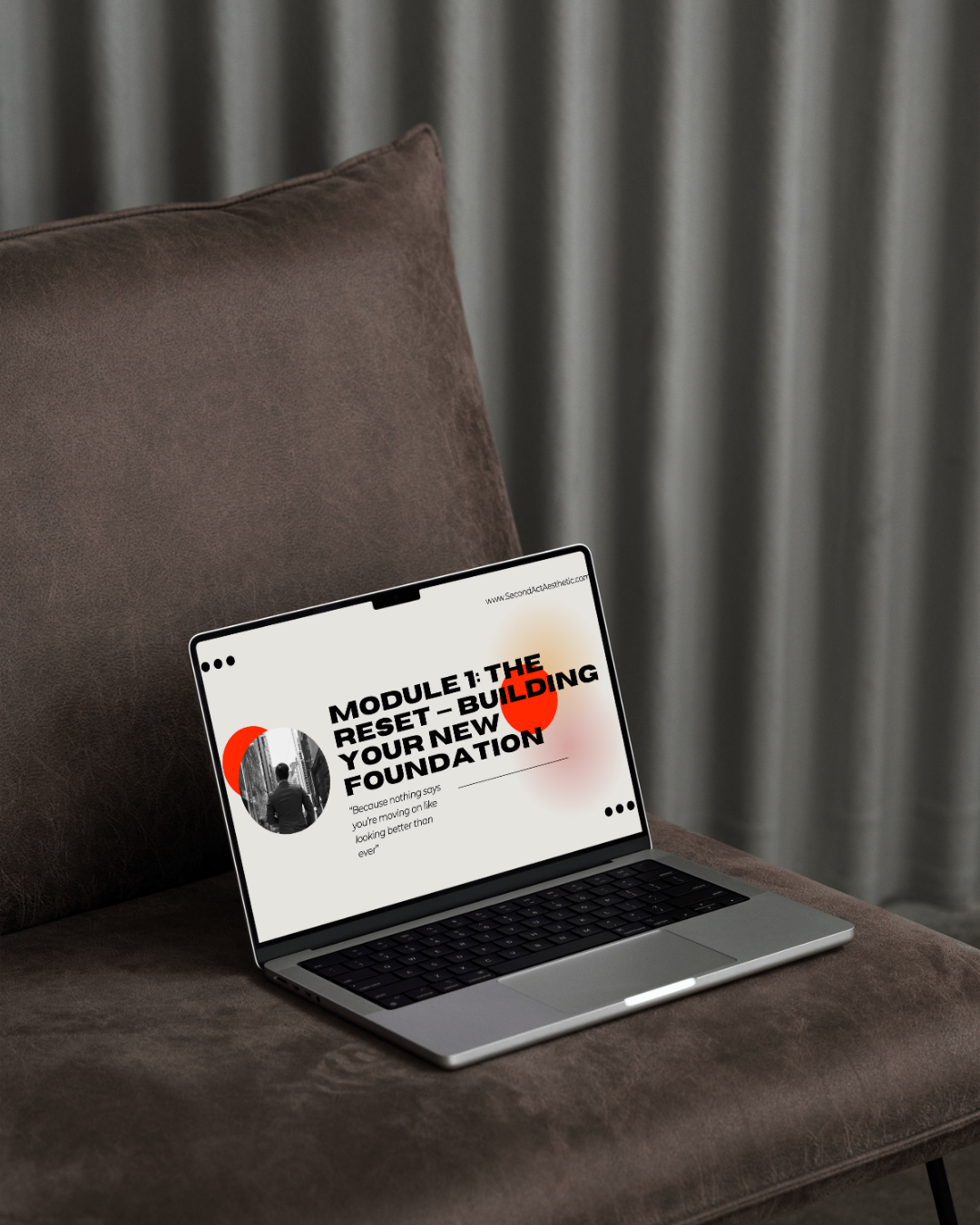 A laptop on a brown sofa displays a course module titled 'Module 1: The Reset - Building Your New Foundation' with a quote underneath.