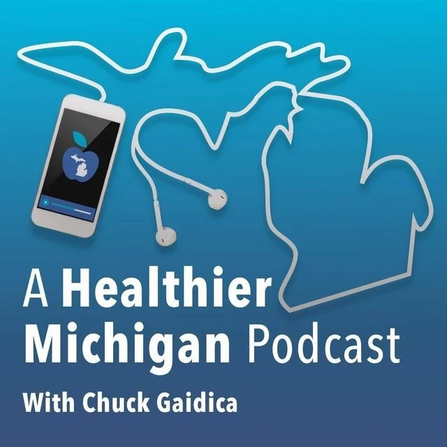 An illustration with a stethoscope forming Michigan's outline, a smartphone displaying a heart and apple logo, and the text "A Healthier Michigan Podcast with Chuck Gaidica" on a blue background.