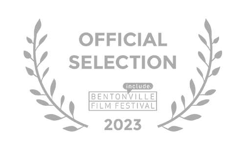 Official selection emblem for the Bentonville Film Festival 2023, featuring laurel branches surrounding the text.