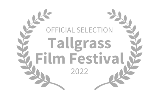 Laurel wreath surrounds text that reads 'Official Selection Tallgrass Film Festival 2022'.