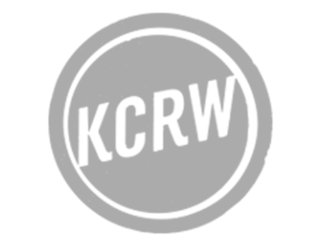 Gray circular stamp with the text 'KCRW' inside.
