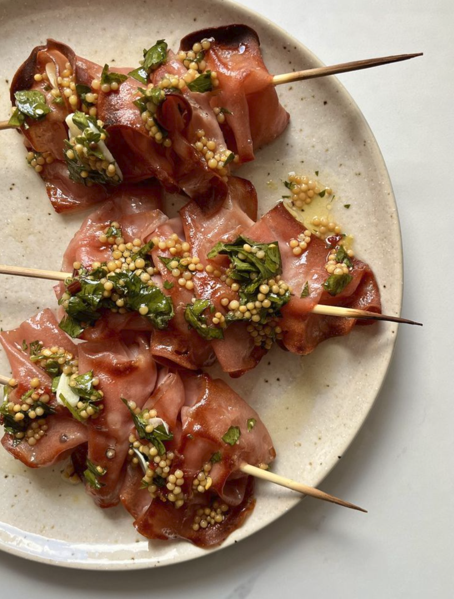 Grilled mortadella skewers with melon, pistachio, and spices - $20