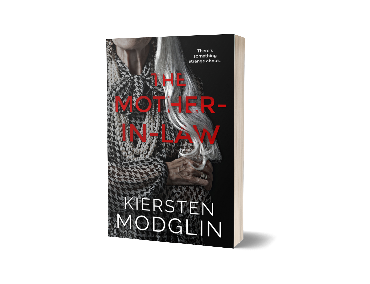 Book cover titled 'The Mother-In-Law' by Kiersten Modglin, featuring a grayscale photo of an elderly woman with long hair, wearing a patterned blouse and a pearl necklace, with a black background.
