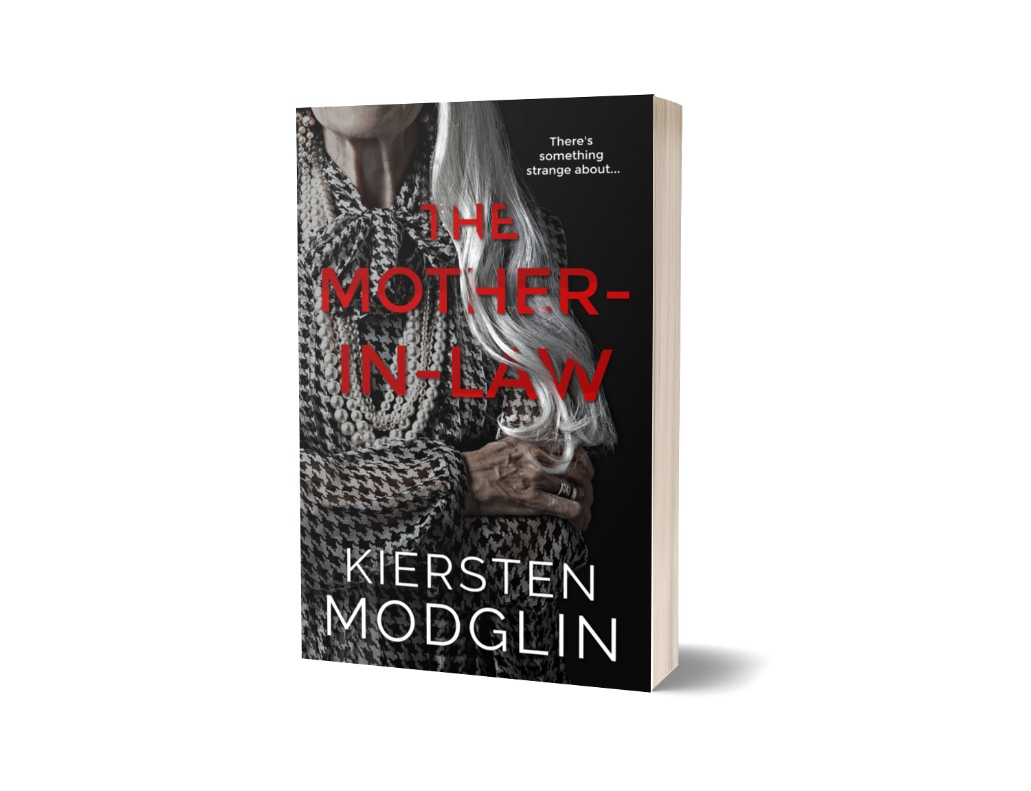 Book cover for 'The Mother-In-Law' by Kiersten Modglin featuring a black and white image of an elderly woman with long white hair, dressed in a houndstooth patterned outfit with a bow-tie, holding her hands across her chest against a black background.