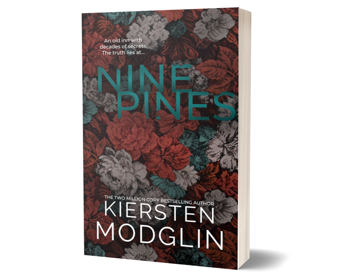 Book cover for 'Nine Pines' by Kiersten Modglin, featuring a floral pattern with red, gray, teal, and black flowers, and the text indicating it is a mystery novel about an old inn with secrets.
