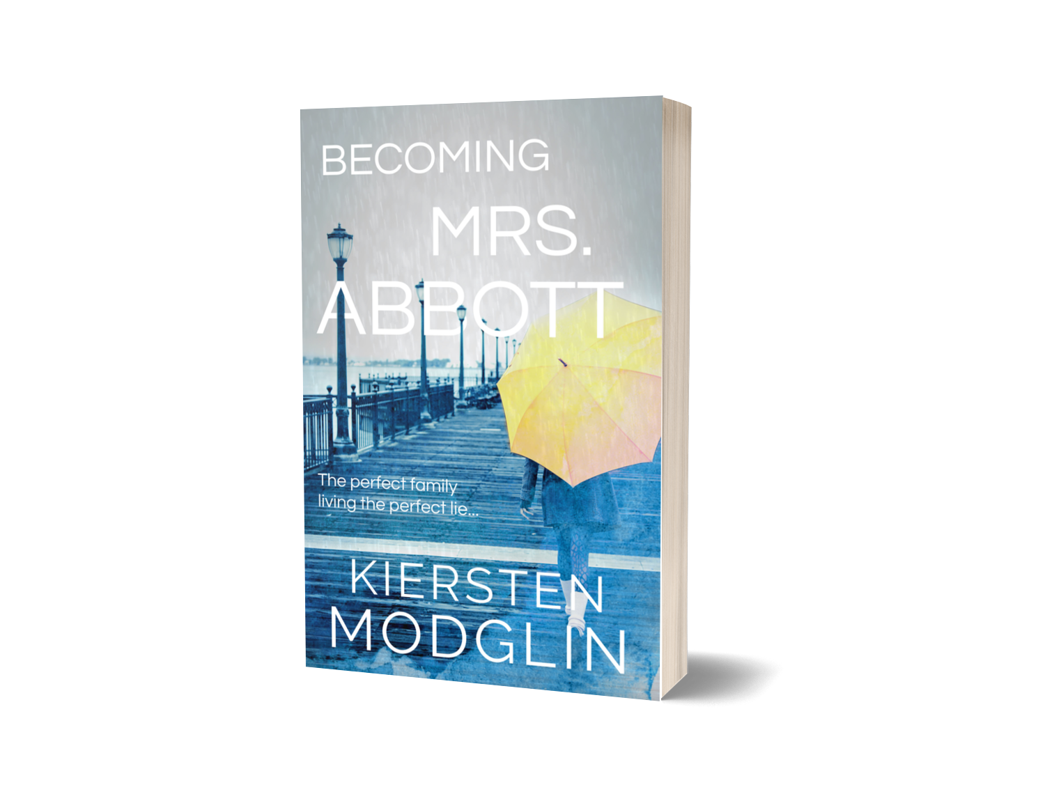 The book titled 'Becoming Mrs. Abbott' by Kiersten Modglin. The cover shows a person holding a yellow and pink umbrella walking along a rainy pier with street lamps.