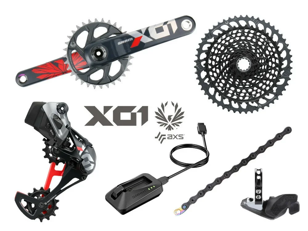 Bike derailleur, cassette, chain, crankset, e-bike display, charging cable, brake pedal, and chainring, all parts of a high-end mountain bike.