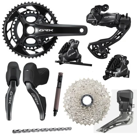 Collection of bicycle components including crankset, derailleur, shifters, cassette, chain, and bottom bracket.