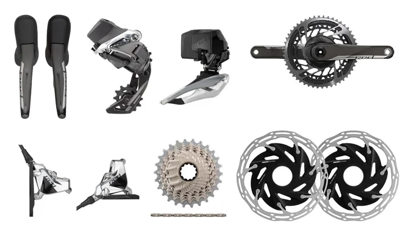 Various bicycle components including drop handlebars, front derailleur, rear derailleur, crankset, shifters, cassette, chain, and disc brake rotors.
