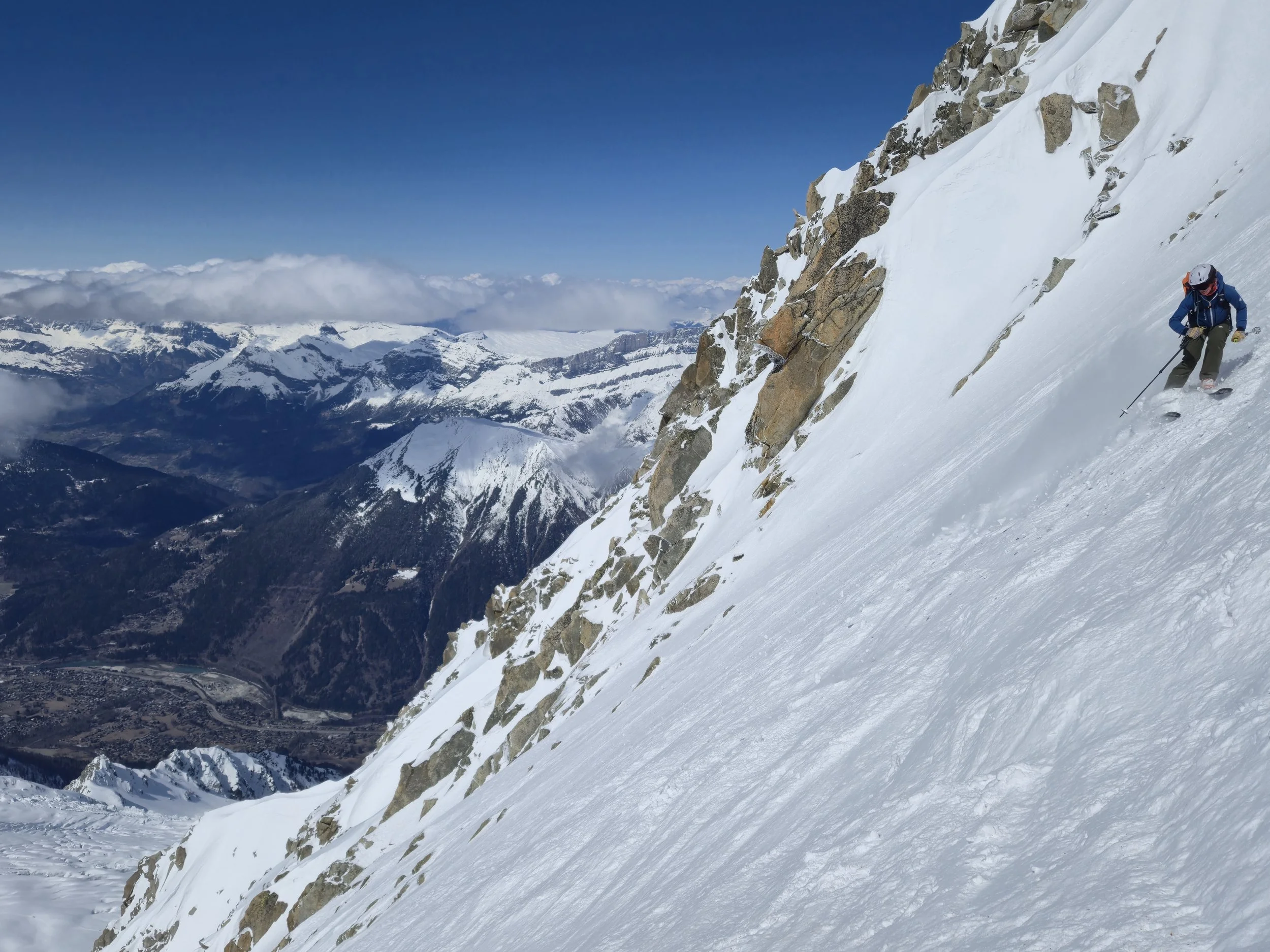 Backcountry ski group learning snowpack assessment during AIARE avalanche course in the White Mountains