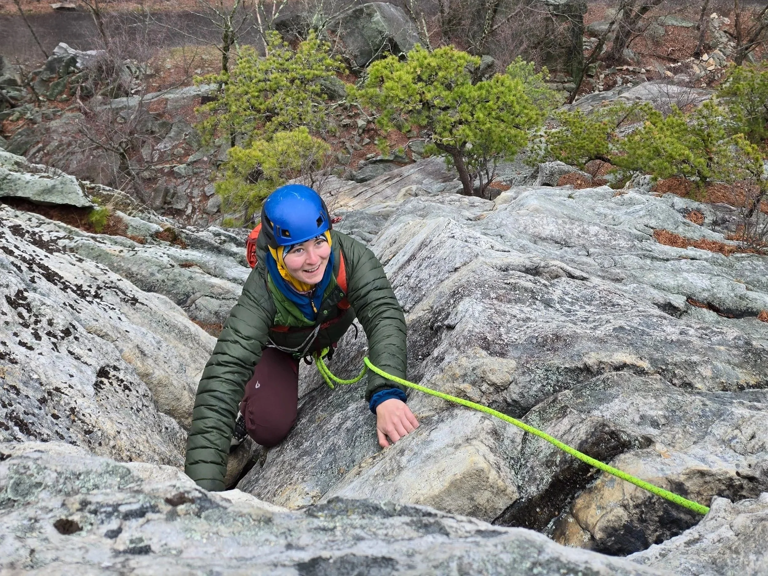 Beginner learning outdoor rock climbing in the Gunks with guided support