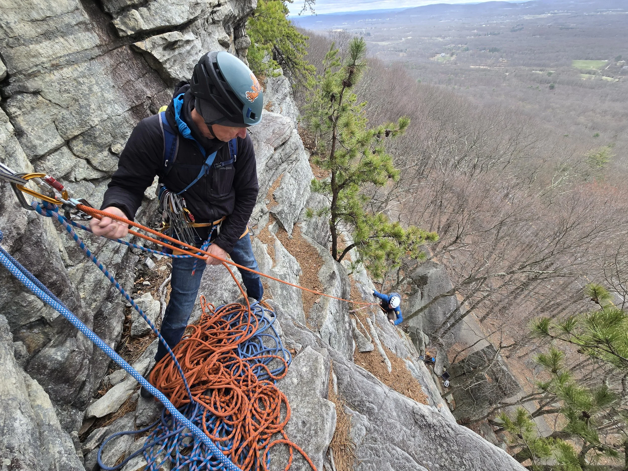 Experienced climber belaying on a classic Gunks cliff