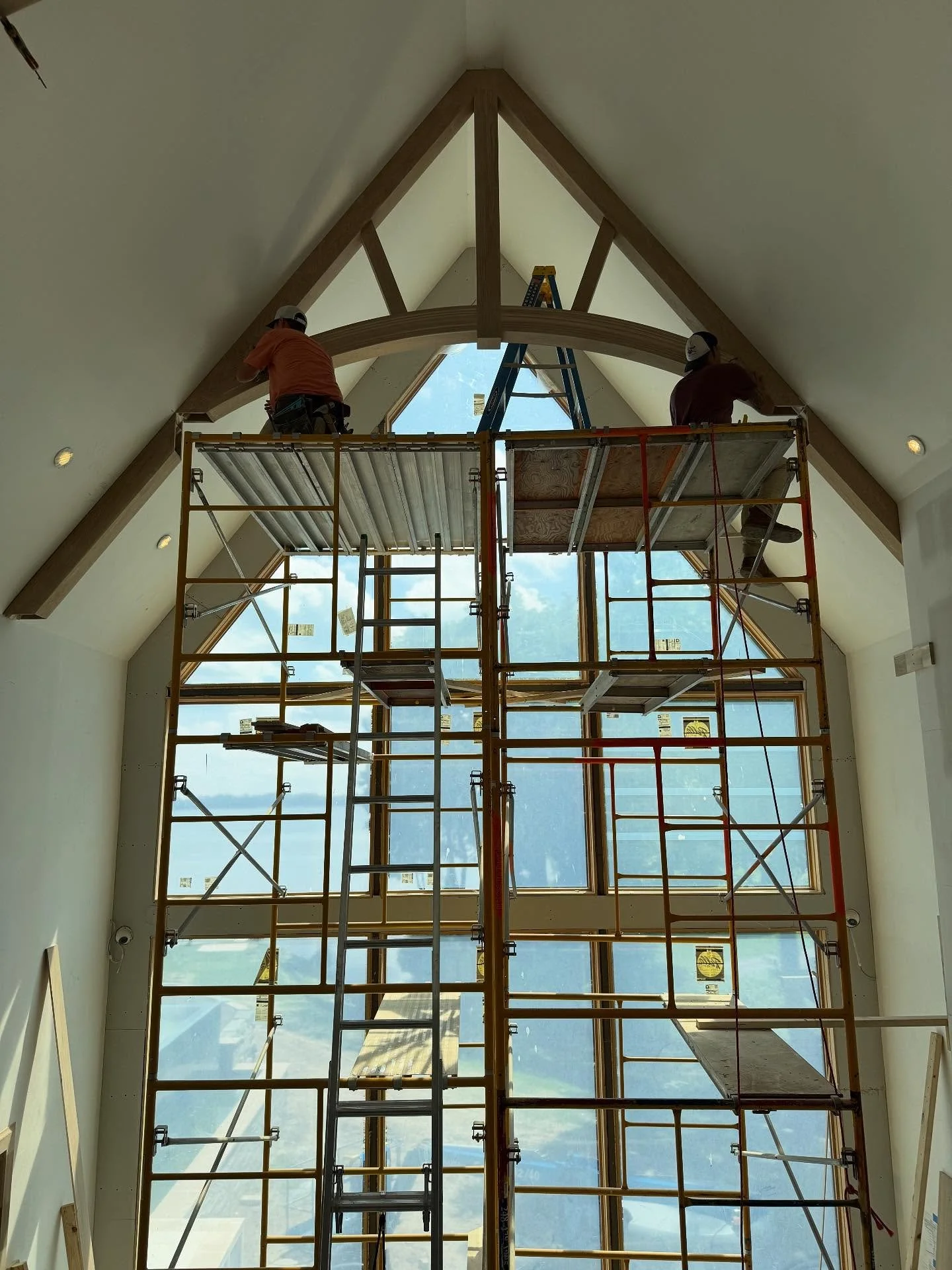 Our Orchard Lake renovation is almost ready for paint! The master shower, custom truss beams, and walnut fireplace are just a glimpse of how beautifully this home is coming together. #hauscustomhomes #customhomebuilder #customhomes #luxuryhomes #mich