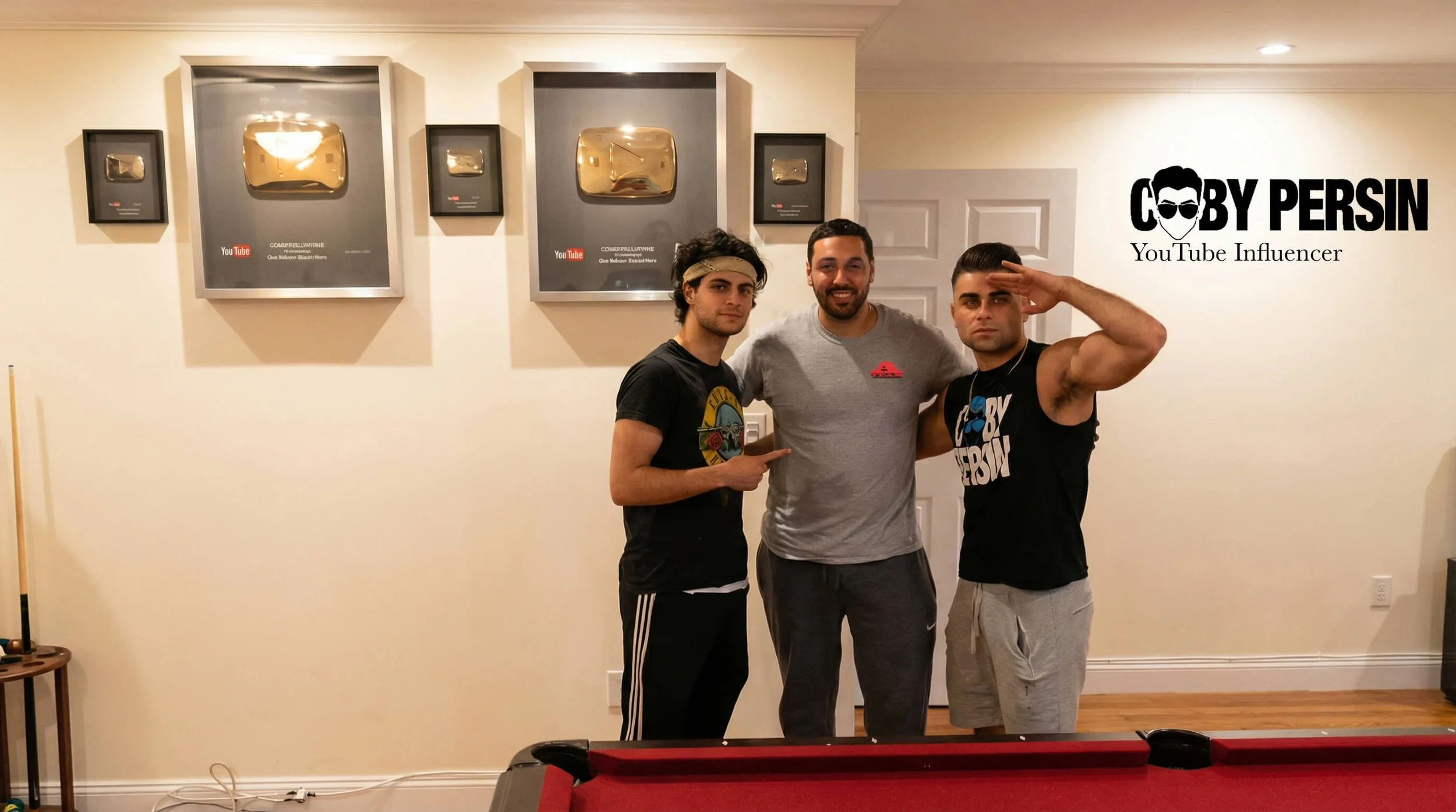Three men standing together in a room, one of them saluting. The wall behind them features framed YouTube awards and the text "COBY PERSIN YouTube Influencer" with a face wearing sunglasses logo.