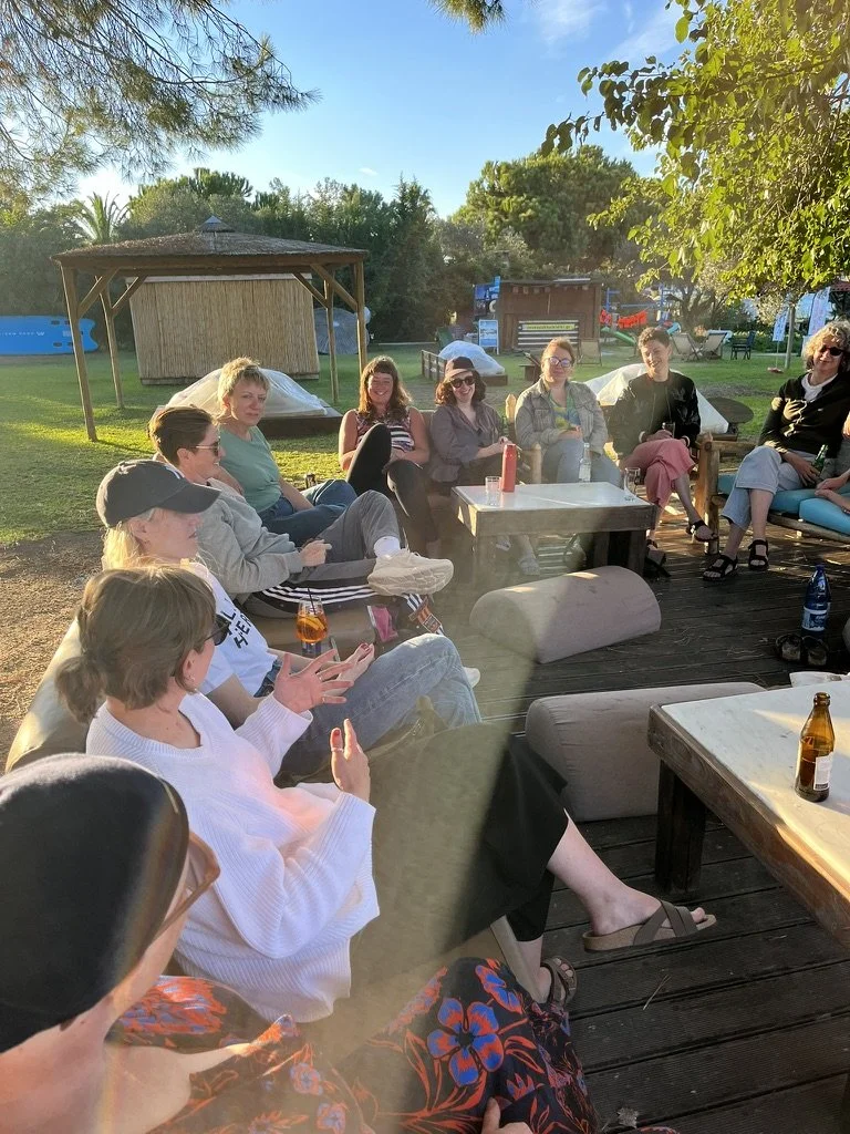 Writers sharing knowledge at a group session on an Ink and Salt writing retreats in Halkidiki, Greece