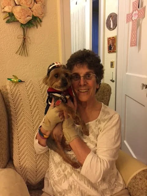 Sister Ave holding dog close