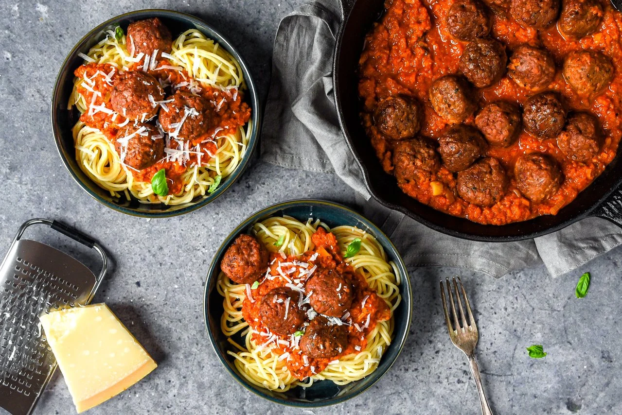 Plantbased meatballs with vegan cheese and spaghetti