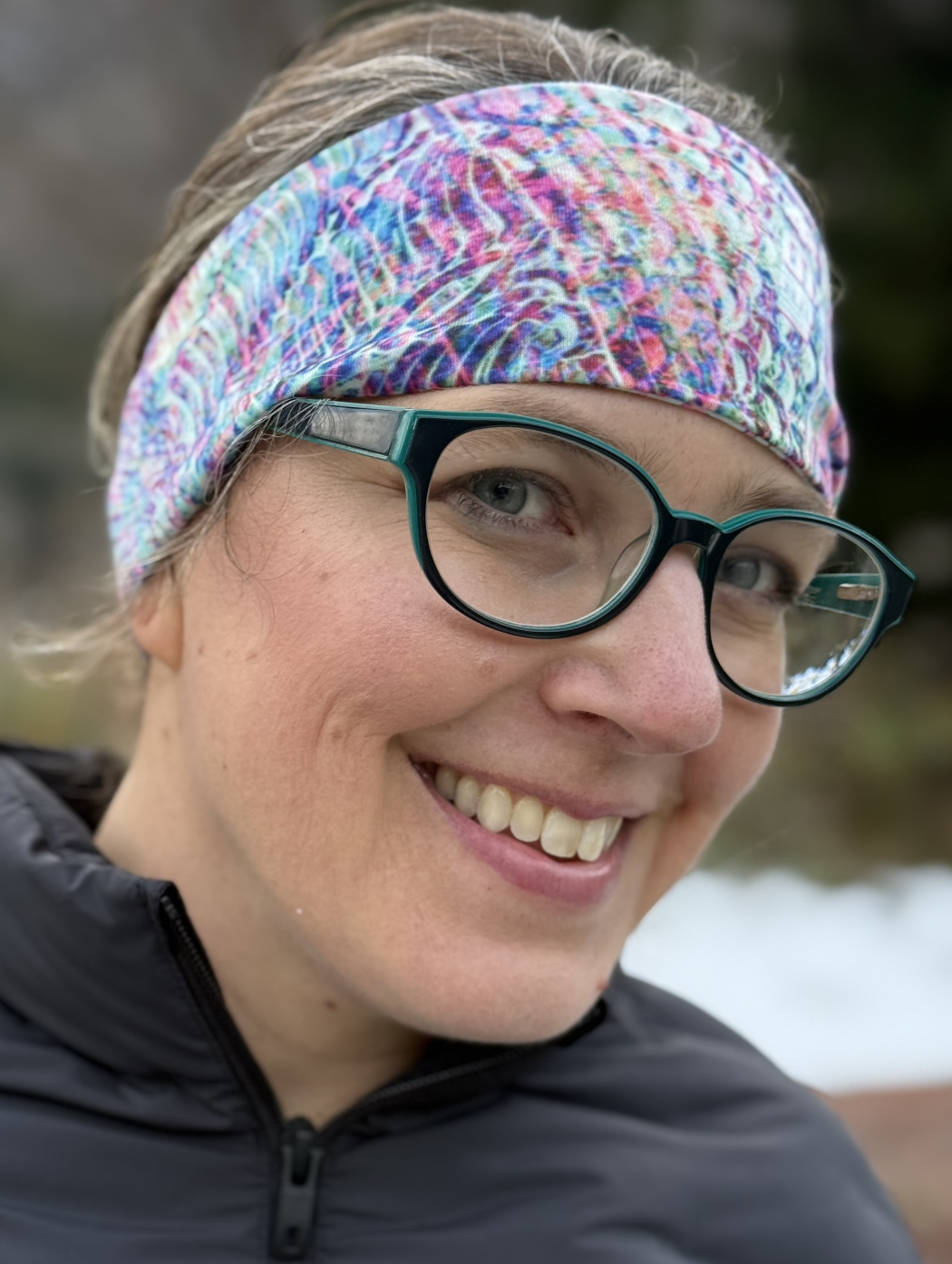 Woman wearing Colorful headband with Japanese words for Japan snow.
