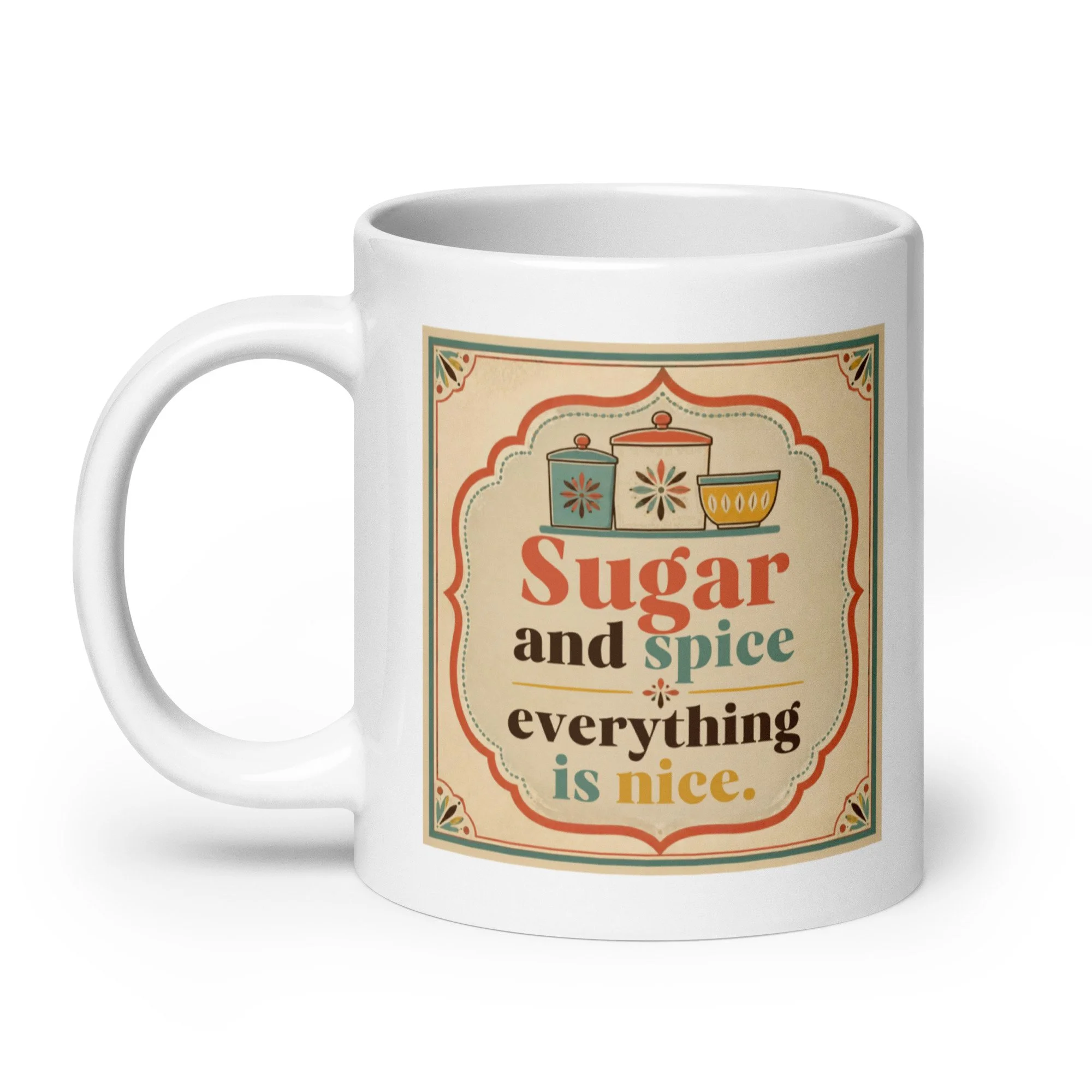 White ceramic mug with “Sugar and spice everything is nice” vintage kitchen design, handle view.