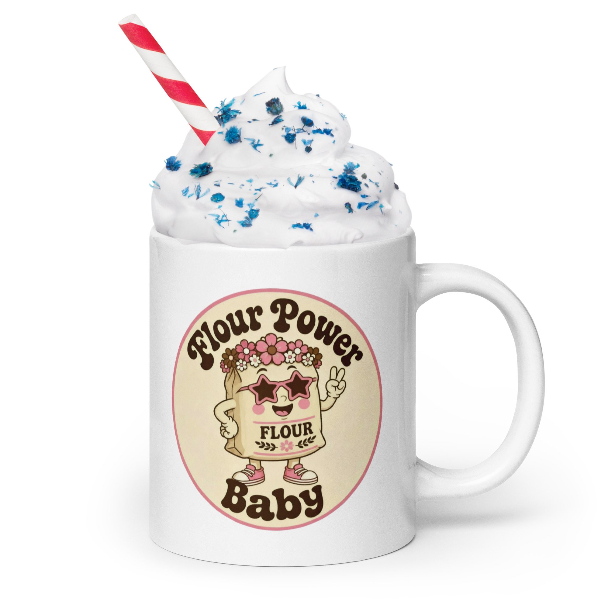 “Flour Power Baby” retro baking mug filled with whipped cream and sprinkles, with a striped straw.