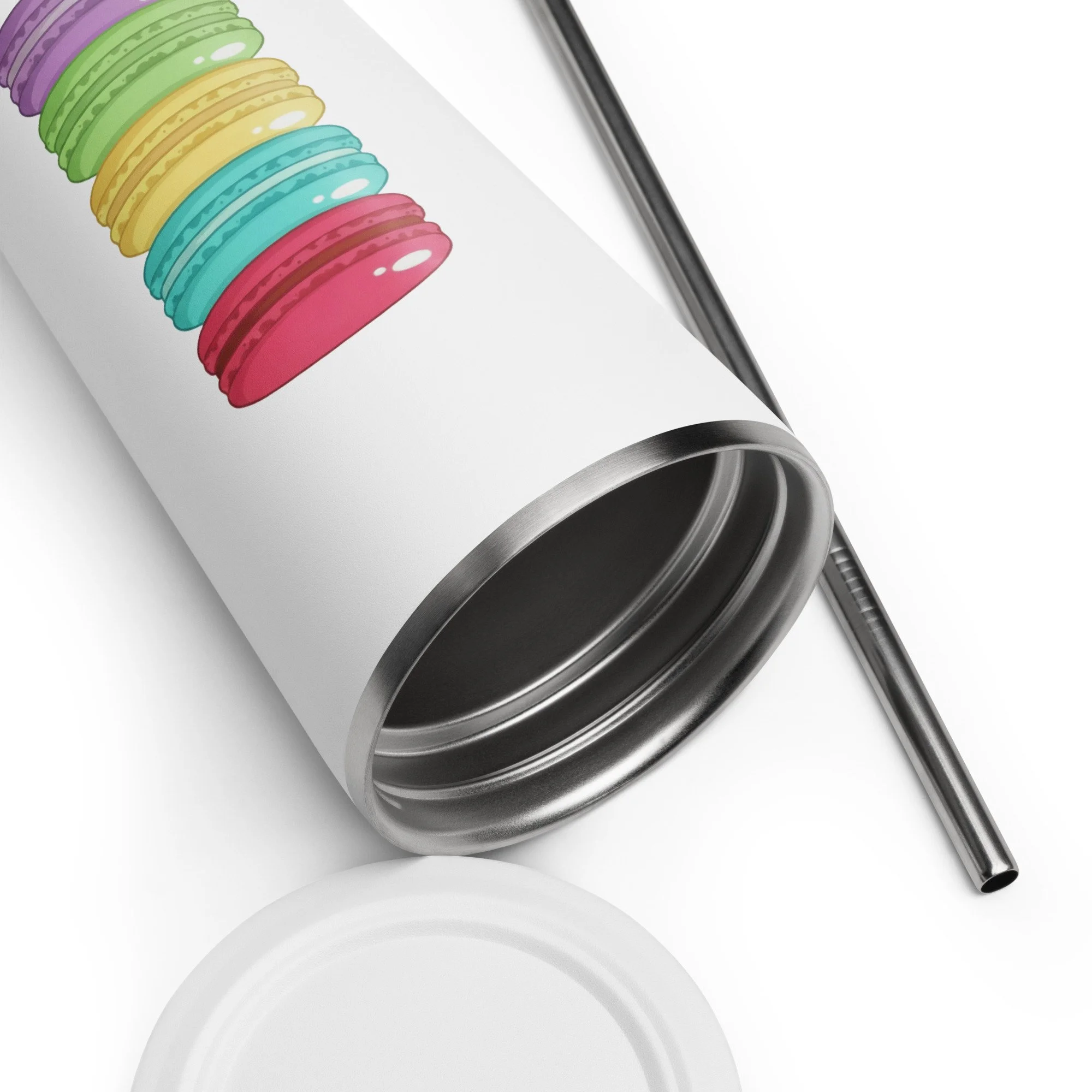 Close-up of the insulated tumbler showing the bright macaron stack design near the rim with straw beside it.