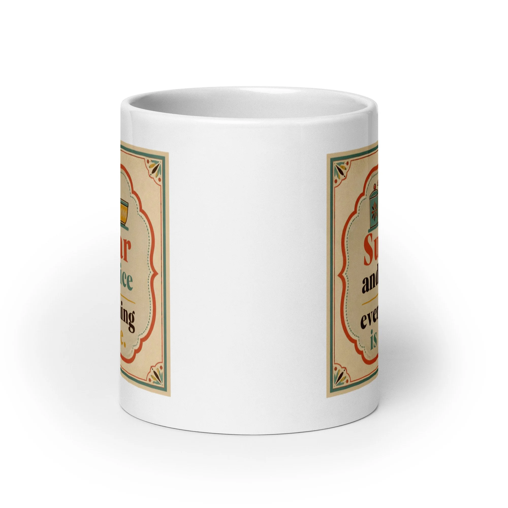 White ceramic mug showing the wraparound “Sugar and spice everything is nice” design from the side.
