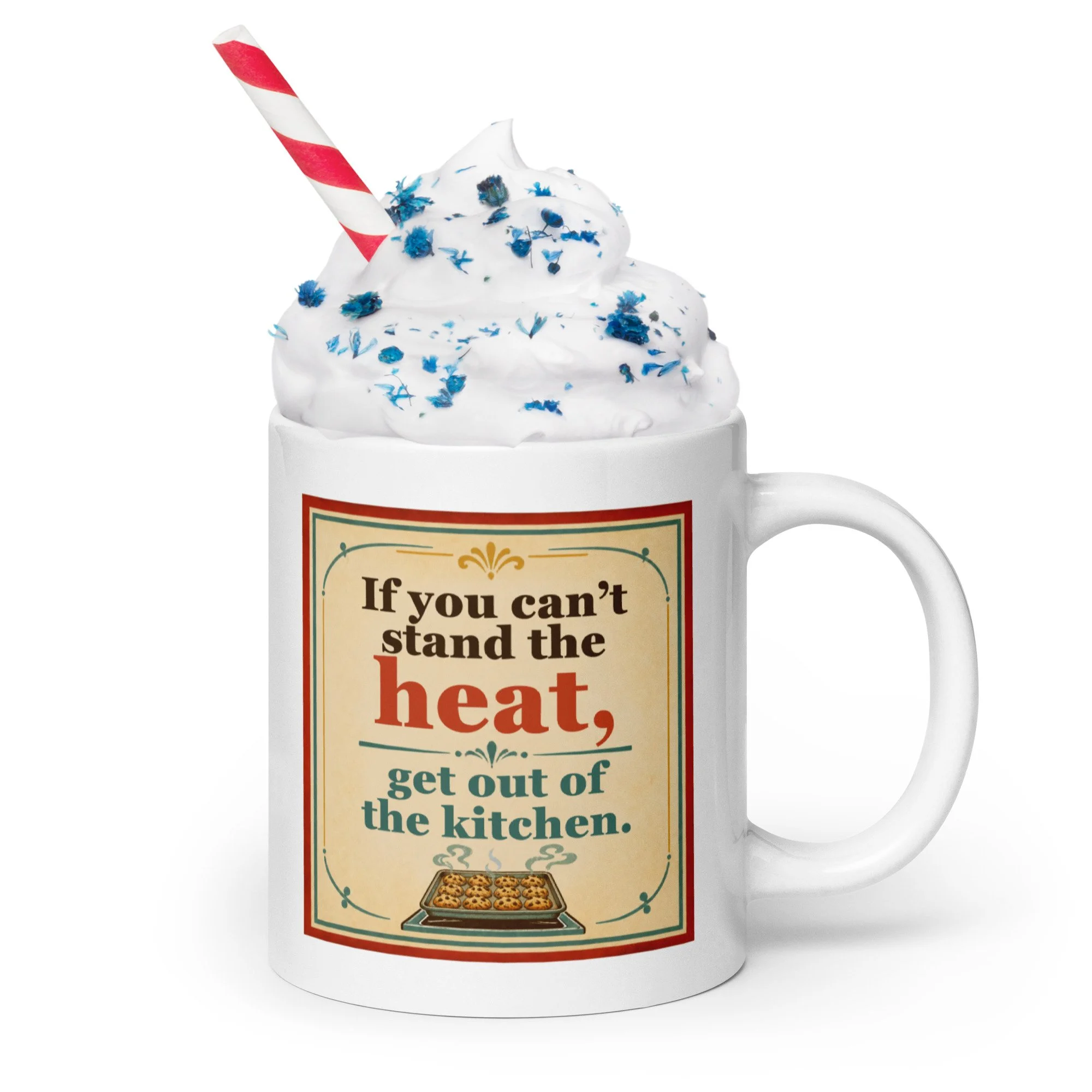 White ceramic mug with “If you can’t stand the heat, get out of the kitchen” design shown with whipped cream and sprinkles.