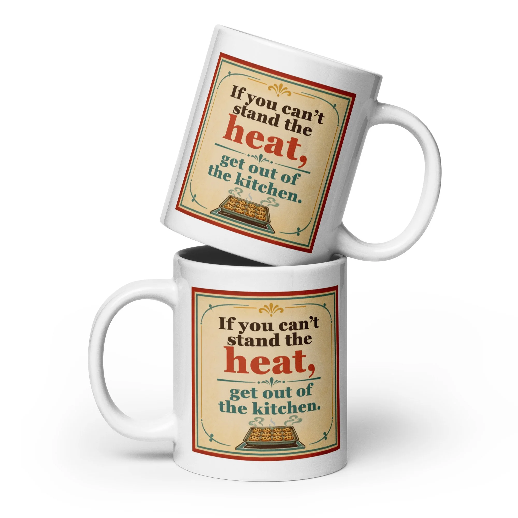 Two stacked white ceramic mugs featuring the “If you can’t stand the heat, get out of the kitchen” vintage design.