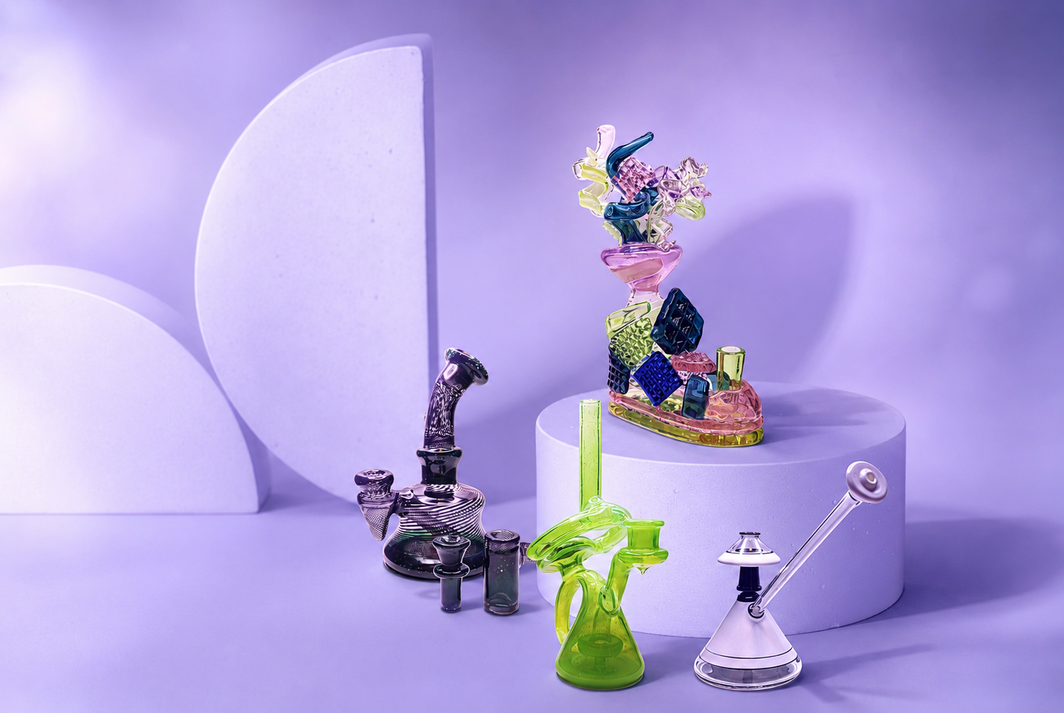 Colorful glass art sculptures displayed on white circular platforms against a purple background.