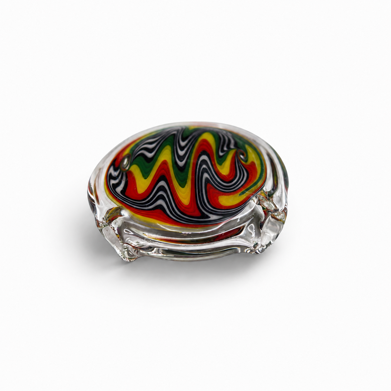 Colorful glass ashtray with swirling red, yellow, green, black, and white patterns on a white background.
