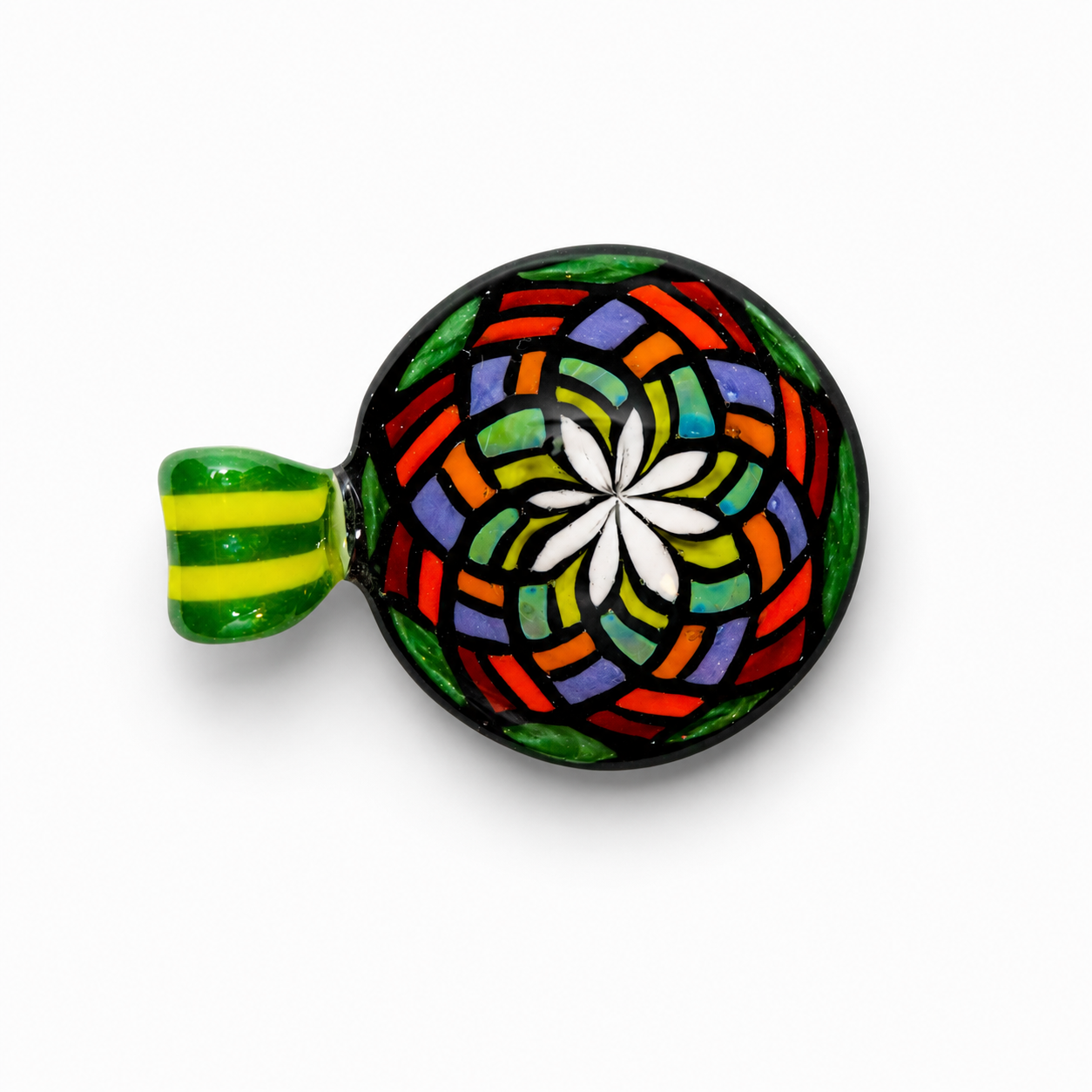 Colorful glass mosaic bowl with a handle, featuring a floral pattern in red, blue, green, yellow, black, and white, on a white background.