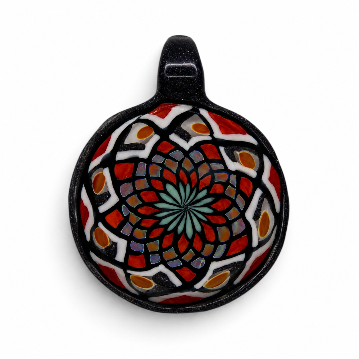 Colorful mosaic turtle-shaped glass artwork with intricate patterns in red, black, white, and orange on a white background.