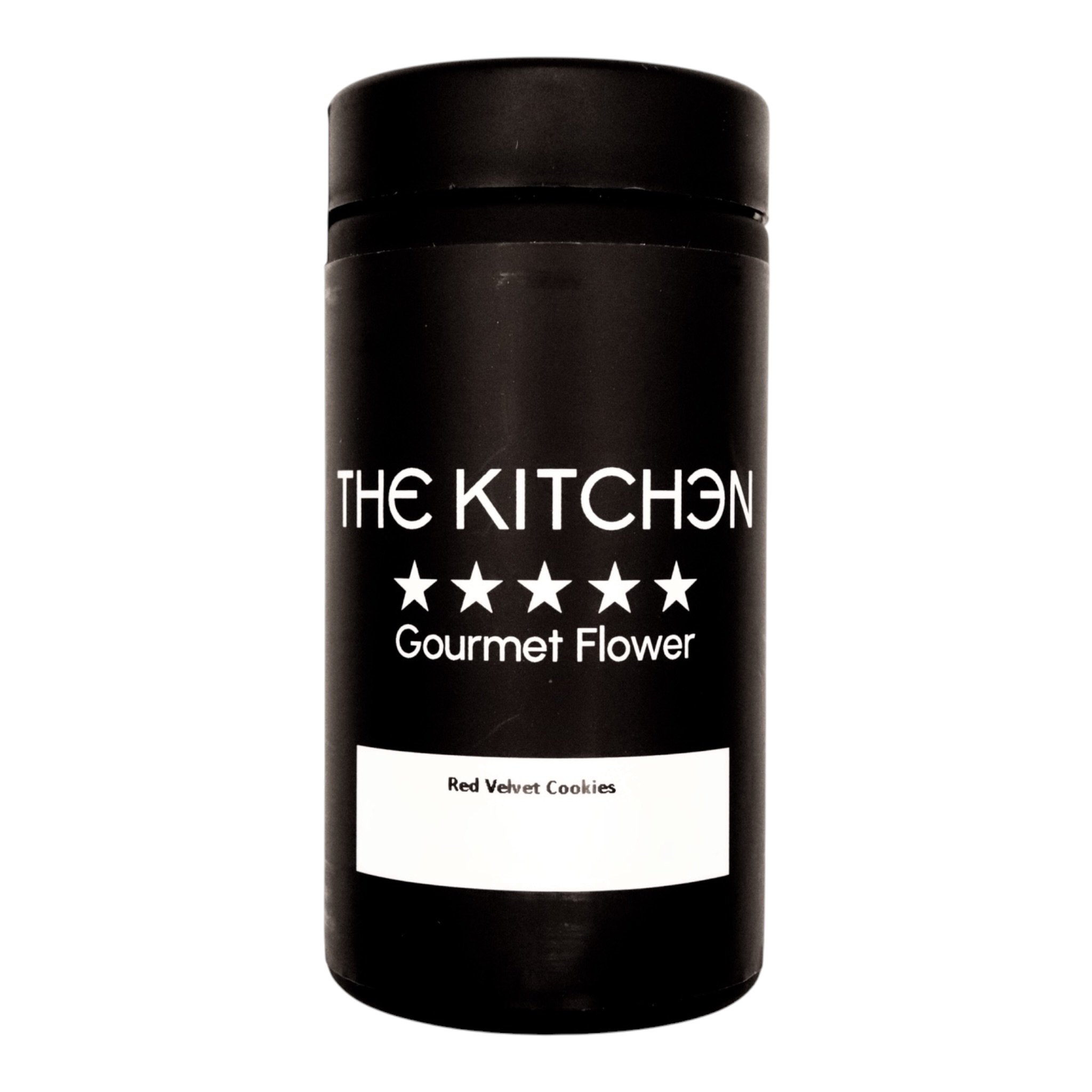 A black container labeled 'The Kitchen' with white text, stars, and the words 'Gourmet Flower' and 'Red Velvet Cookies'.