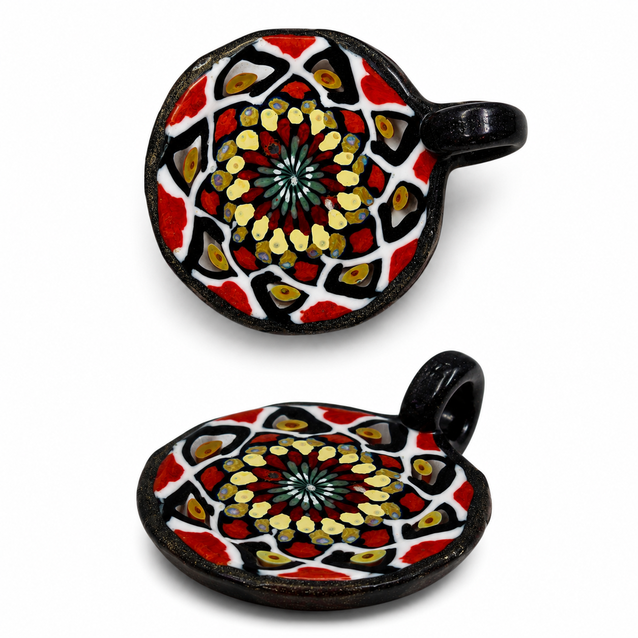 Two decorative Murano glass bowls with swirling patterns in red, black, white, and yellow, set against a white background.
