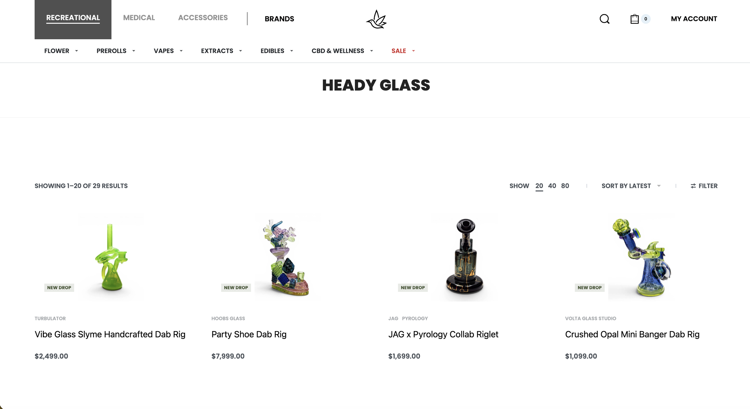 Online store webpage showcasing various handcrafted glass dab rigs, including the Vibe Glass Slyme Handcrafted Dab Rig, Party Shoe Dab Rig, JAG x Pyrograph Collab Riglet, and Crushed Opal Mini Banger Dab Rig, each with prices and labeled as new drop.