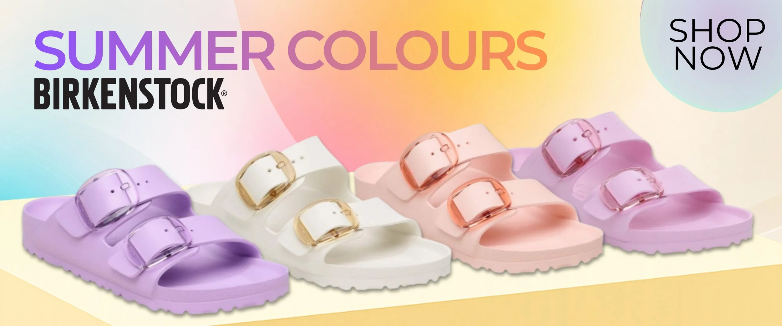 Advertisement for Birkenstock summer-colored sandals featuring three pairs in lavender, white, and pink with adjustable buckle straps, set against a pastel rainbow background with bold black and colorful text reading 'SUMMER COLOURS BIRKENSTOCK' and a 'SHOP NOW' button.
