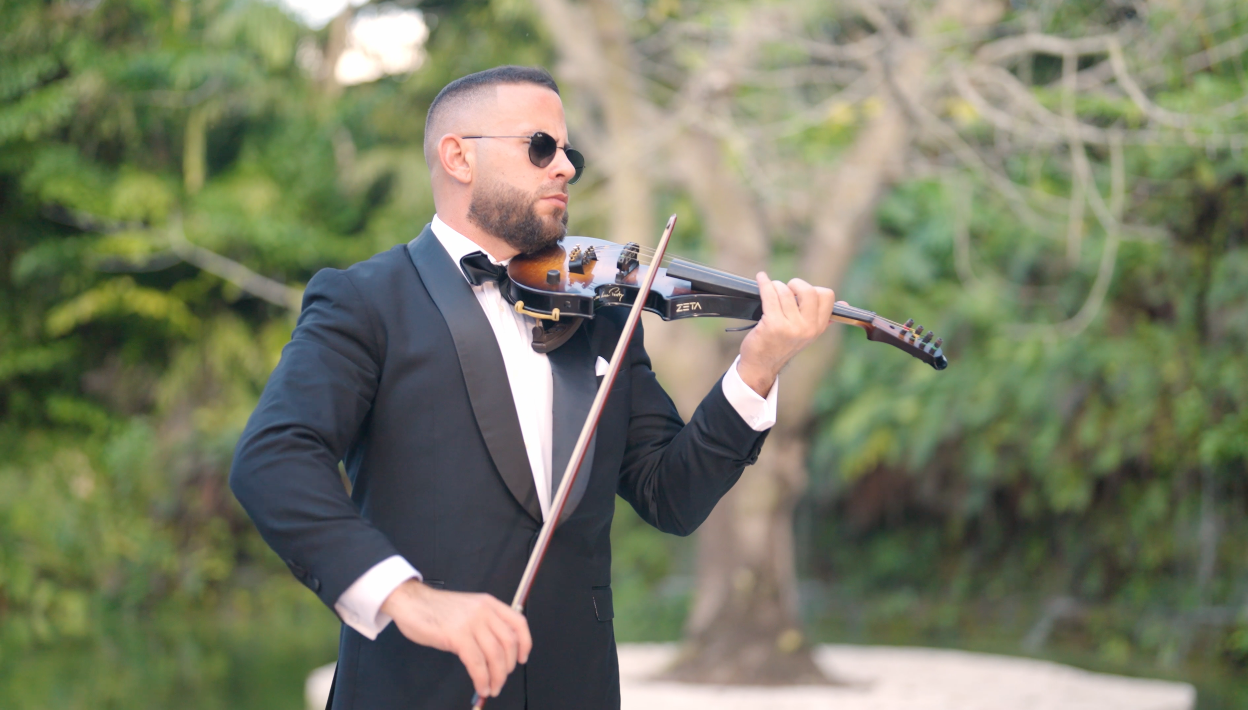 Live violin performance during wedding ceremony at Fica Farms Miami