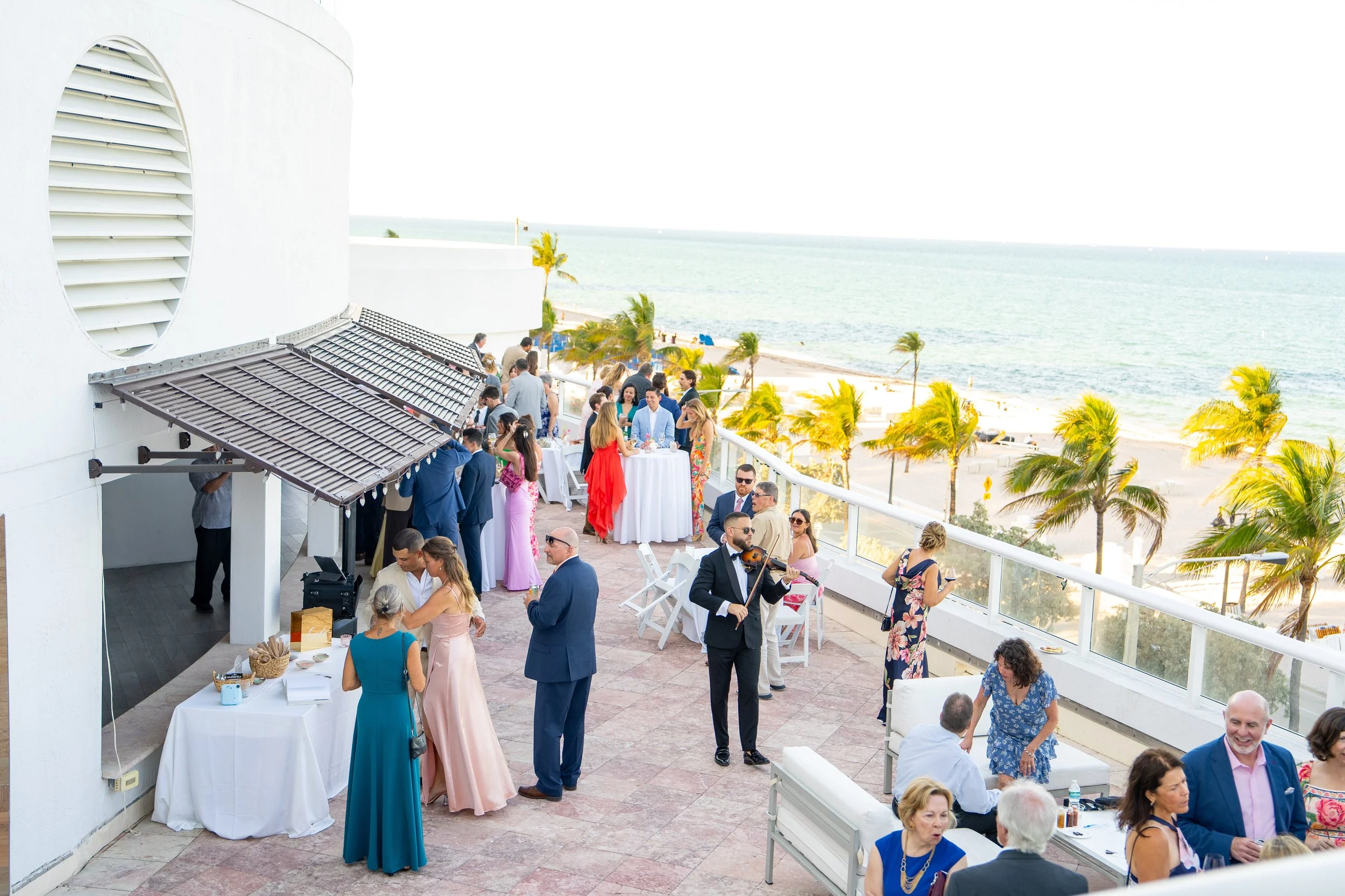 Violinist performing during cocktail hour at Beach House Fort Lauderdale