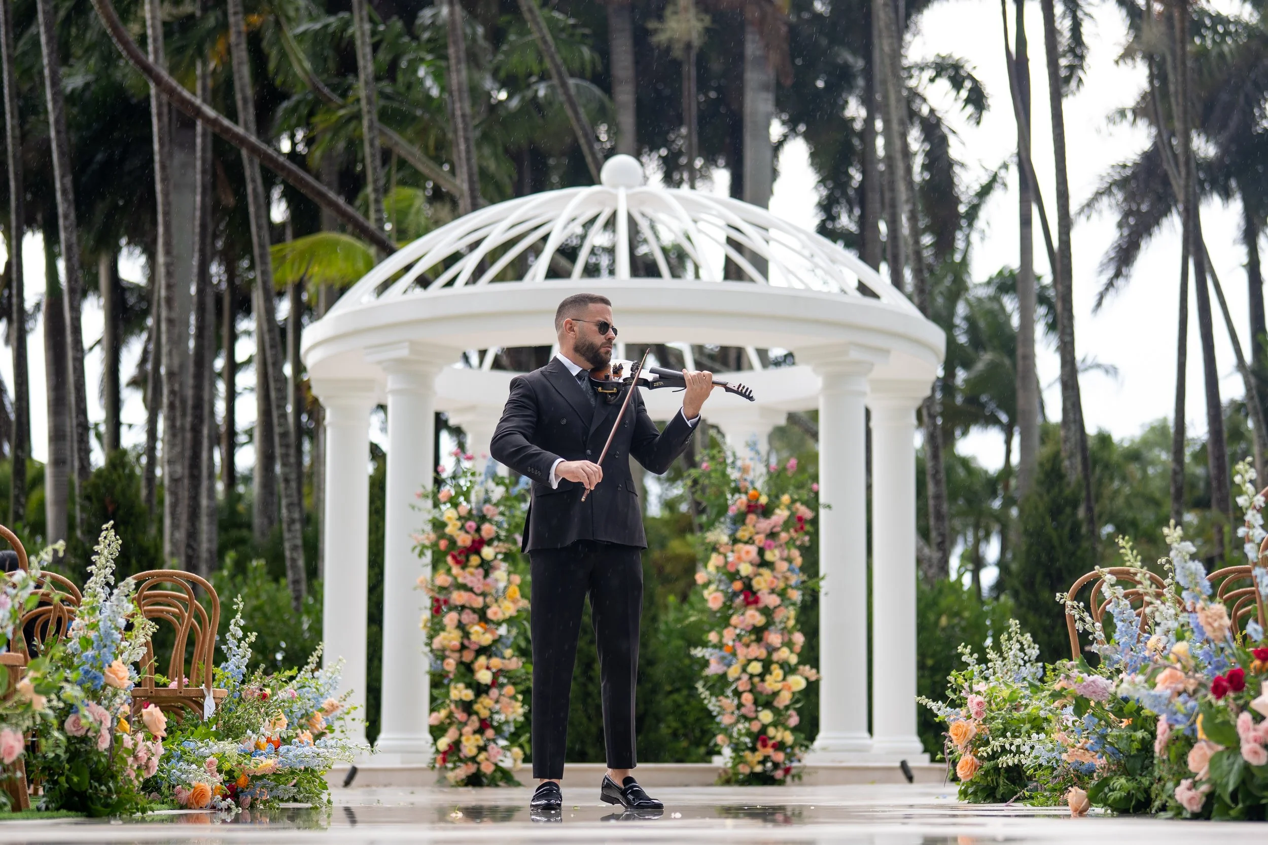 Wedding violinist performing during ceremony at Gran Paraiso Gardens in Miami