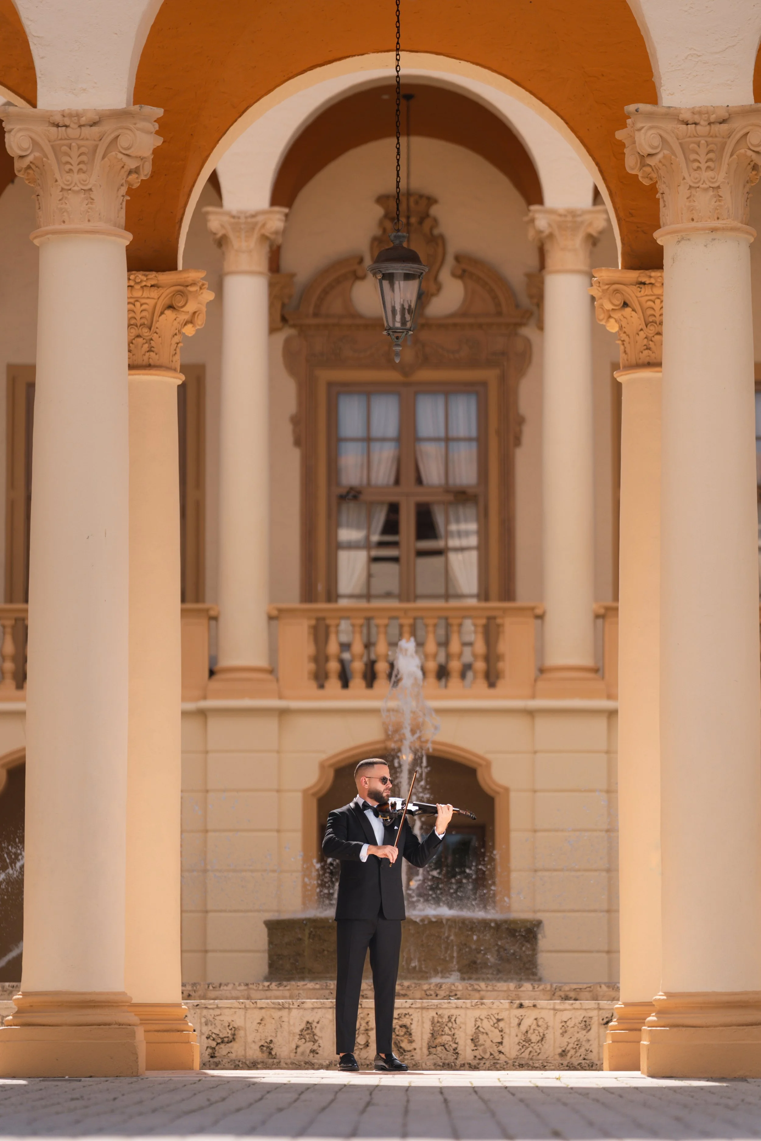 Wedding cocktail hour violinist performing live at a luxury Miami wedding at the historic Biltmore Hotel.